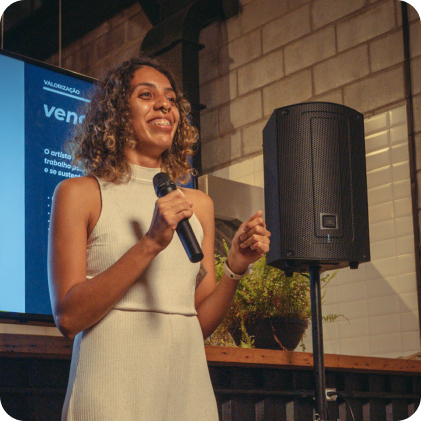 Speaker on stage with a JBL Professional speaker