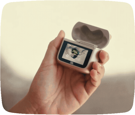 Hand holding the JBL Tour Pro 3 touchscreen Smart Charging Case